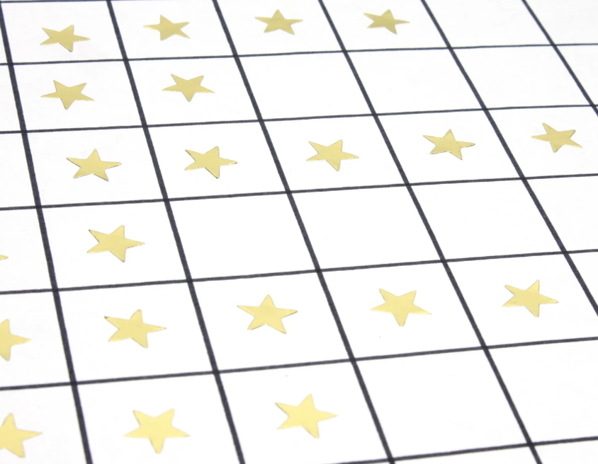 Gold star stickers on a chart grid